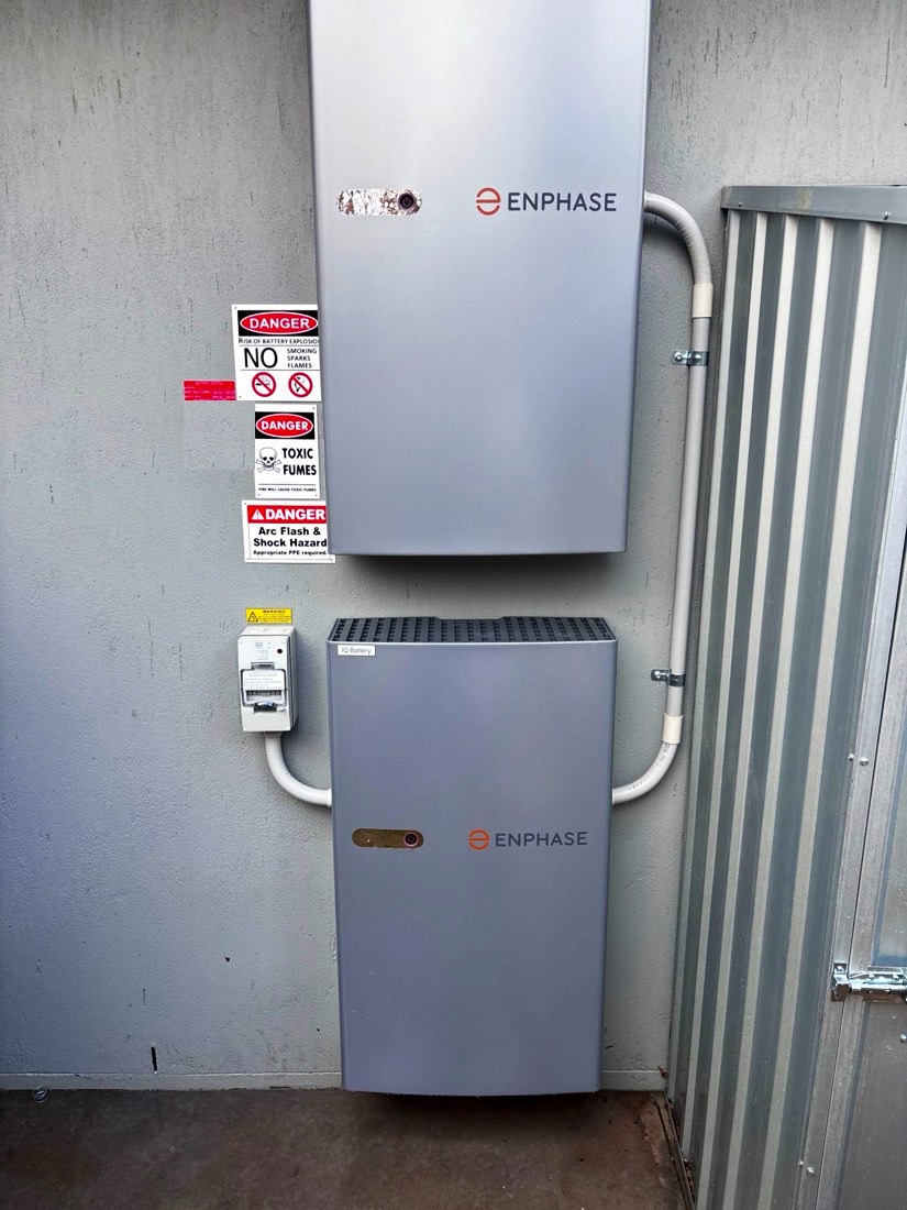 Enphase IQ System Controller mounted above an Enphase IQ Battery on a rendered wall