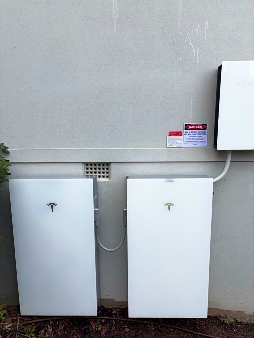 Two Tesla Powerwalls side by side with a Tesla Gateway in Weston Creek